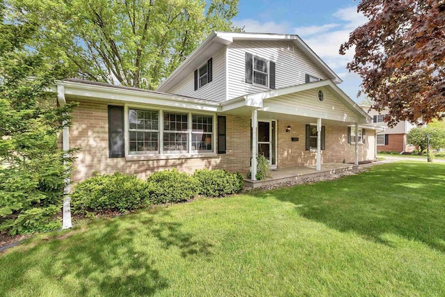 108 S Clay St, De Pere, WI 54115 - traditional-style home featuring brick siding, a front lawn, and covered porch