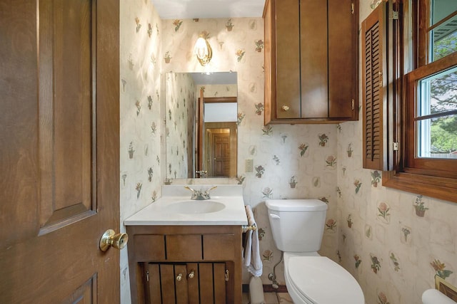 108 S Clay St, De Pere, WI 54115 - half bathroom with toilet, wallpapered walls, and vanity