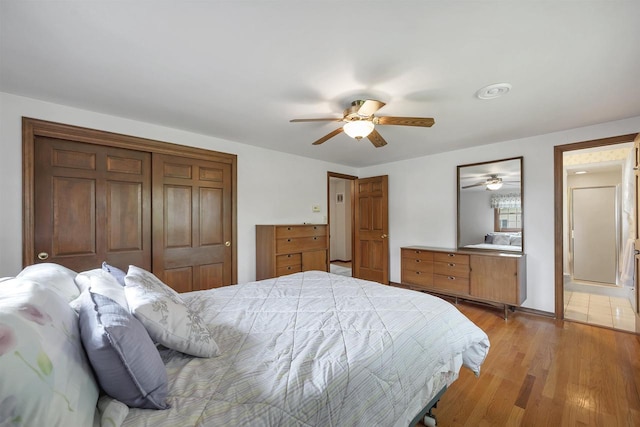 108 S Clay St, De Pere, WI 54115 - bedroom with light wood-style floors, a closet, and ceiling fan