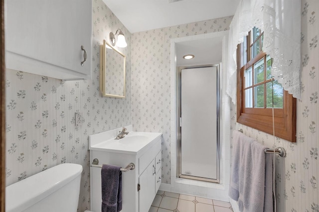 108 S Clay St, De Pere, WI 54115 - bathroom with wallpapered walls, vanity, a shower stall, toilet, and tile patterned floors