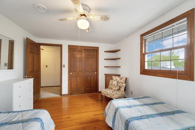 108 S Clay St, De Pere, WI 54115 - bedroom featuring light wood-type flooring, ceiling fan, and a closet