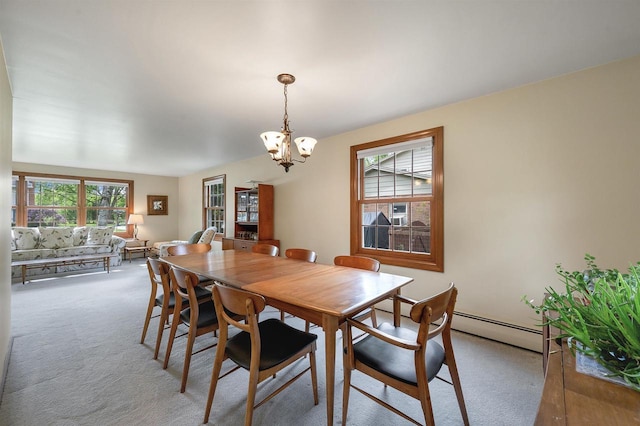 108 S Clay St, De Pere, WI 54115 - dining room with healthy amount of natural light, carpet floors, and a baseboard heating unit