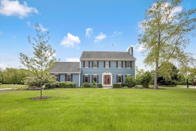 N74W28801 Zimmers Xing, Hartland, WI 53029 - colonial home with a chimney and a front yard