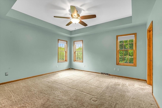 N74W28801 Zimmers Xing, Hartland, WI 53029 - carpeted spare room with plenty of natural light, a ceiling fan, and baseboards