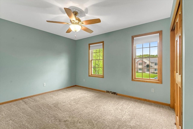 N74W28801 Zimmers Xing, Hartland, WI 53029 - carpeted empty room with baseboards and ceiling fan