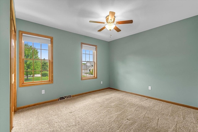 N74W28801 Zimmers Xing, Hartland, WI 53029 - unfurnished room with carpet, baseboards, and ceiling fan