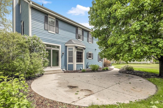 N74W28801 Zimmers Xing, Hartland, WI 53029 - rear view of property with a patio