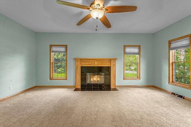 N74W28801 Zimmers Xing, Hartland, WI 53029 - unfurnished living room with carpet flooring, healthy amount of natural light, and a fireplace
