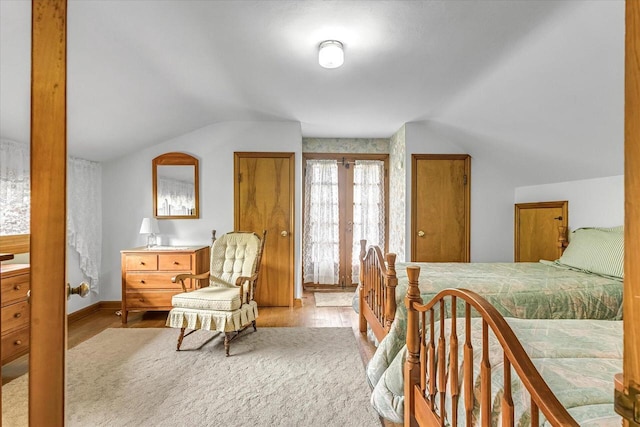 1416 Lake Dr, South Milwaukee, WI 53172 - bedroom with vaulted ceiling, light wood-style floors, french doors, and baseboards