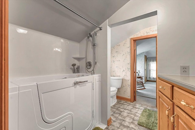 1416 Lake Dr, South Milwaukee, WI 53172 - full bathroom featuring toilet, wallpapered walls, lofted ceiling, shower / tub combination, and baseboards