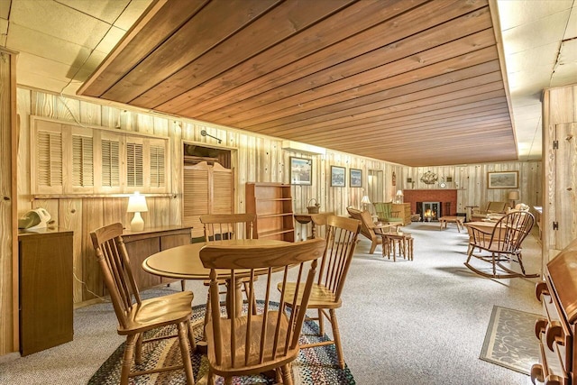 1416 Lake Dr, South Milwaukee, WI 53172 - carpeted dining space with wooden walls, a fireplace, and wood ceiling
