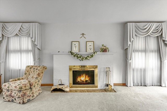 1416 Lake Dr, South Milwaukee, WI 53172 - carpeted living room with a brick fireplace, healthy amount of natural light, and baseboards