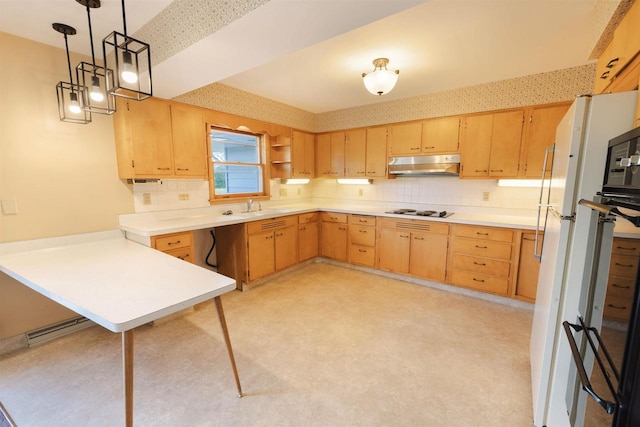 3023 Park Ave, Beloit, WI 53511 - kitchen with under cabinet range hood, a peninsula, light brown cabinets, and light countertops