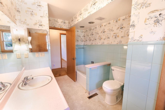 3023 Park Ave, Beloit, WI 53511 - full bath with wallpapered walls, tile walls, a garden tub, toilet, and vanity