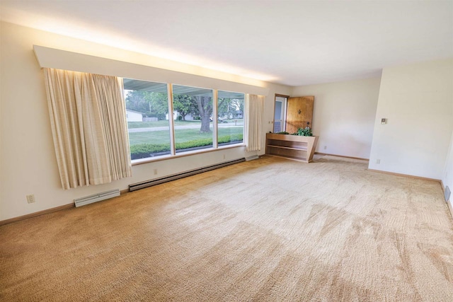 3023 Park Ave, Beloit, WI 53511 - carpeted empty room with a baseboard heating unit, baseboards, and baseboard heating