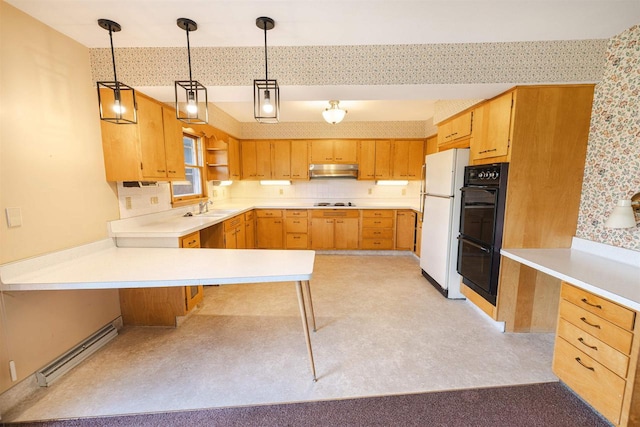 3023 Park Ave, Beloit, WI 53511 - kitchen featuring freestanding refrigerator, a sink, wallpapered walls, under cabinet range hood, and a peninsula