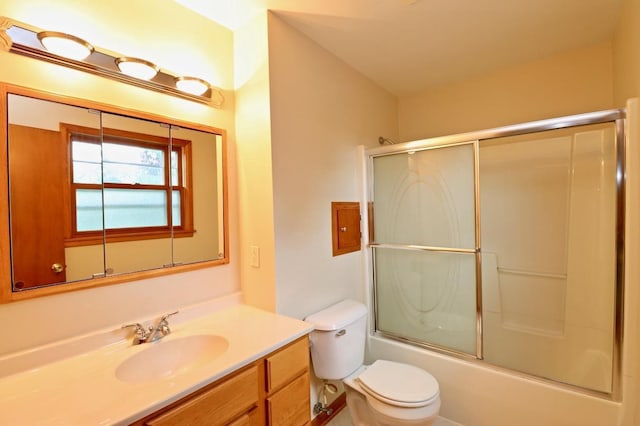 2221 E Easy St, Beloit, WI 53511 - bathroom with vanity, toilet, and combined bath / shower with glass door