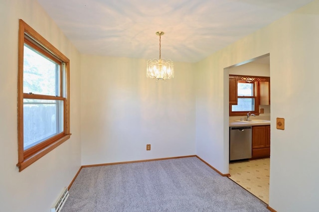 2221 E Easy St, Beloit, WI 53511 - unfurnished dining area with a chandelier, light carpet, baseboards, and a sink