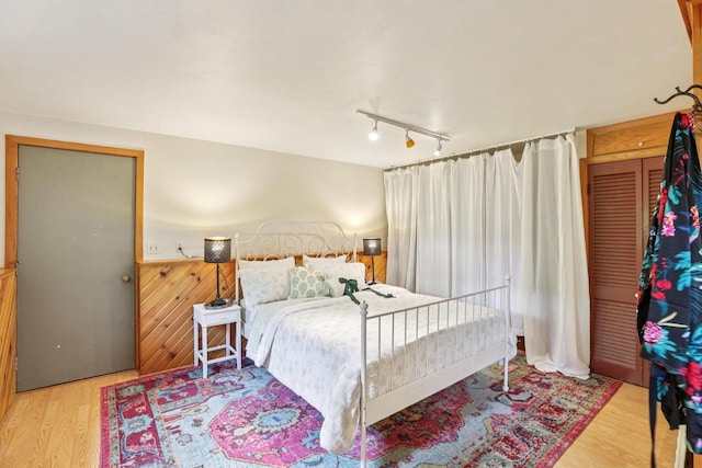 3604 Glenn Ln, Middleton, WI 53562 - bedroom with light wood finished floors and rail lighting