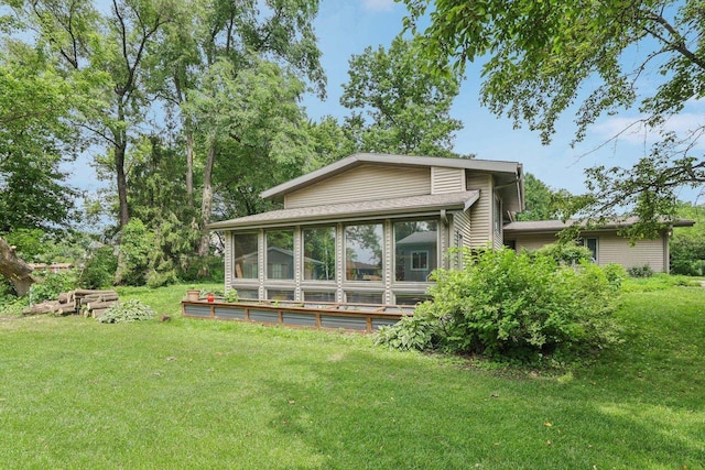 3604 Glenn Ln, Middleton, WI 53562 - back of house featuring a sunroom and a lawn