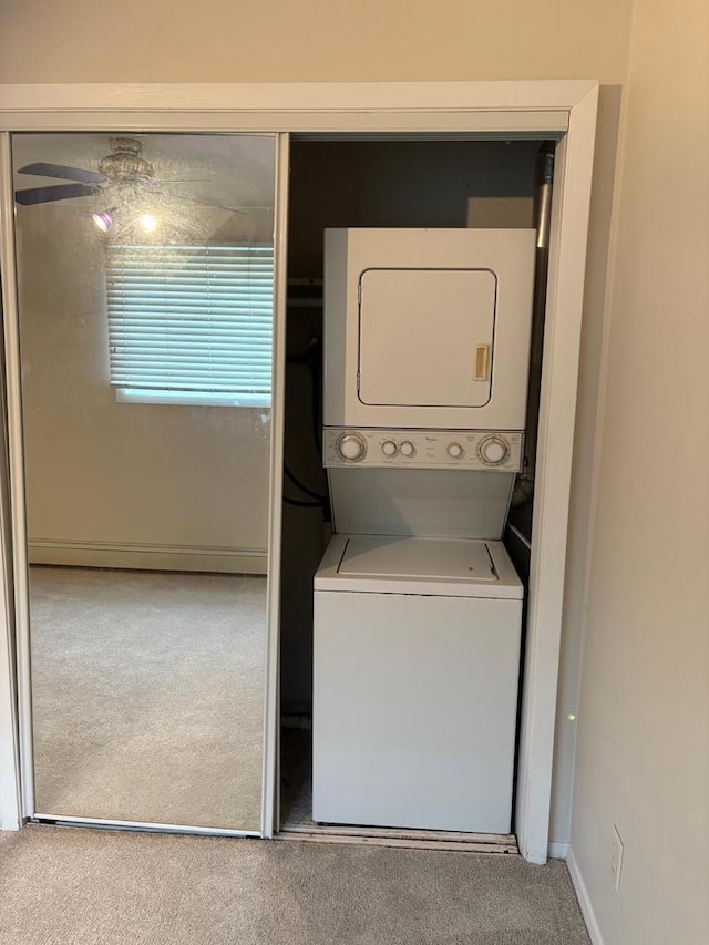 1106 S 7th St Unit 2, Sheboygan, WI 53081 - washroom with stacked washer / dryer and carpet flooring