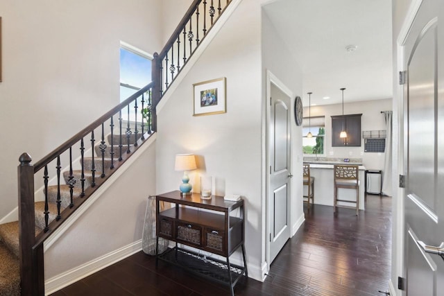 417 Champlain Dr, Johnson Creek, WI 53038 - staircase with hardwood / wood-style flooring and baseboards