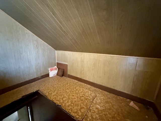 105 Cliff St, Camp Douglas, WI 54618 - bonus room with baseboards, wood walls, and lofted ceiling