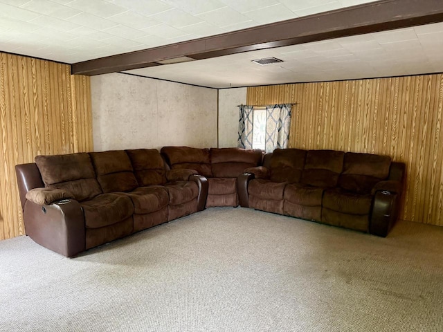 105 Cliff St, Camp Douglas, WI 54618 - living room featuring carpet flooring, wood walls, and beamed ceiling