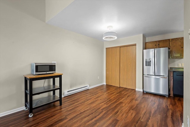 514 Root Ave Unit D, Hartford, WI 53027 - kitchen with appliances with stainless steel finishes, a baseboard radiator, dark wood-type flooring, baseboards, and brown cabinetry