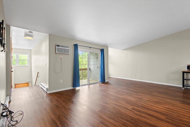 514 Root Ave Unit D, Hartford, WI 53027 - unfurnished living room with a wall mounted AC, baseboard heating, wood finished floors, and plenty of natural light