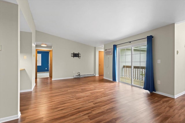 514 Root Ave Unit D, Hartford, WI 53027 - unfurnished living room featuring a baseboard heating unit, a wall unit AC, wood finished floors, baseboards, and vaulted ceiling