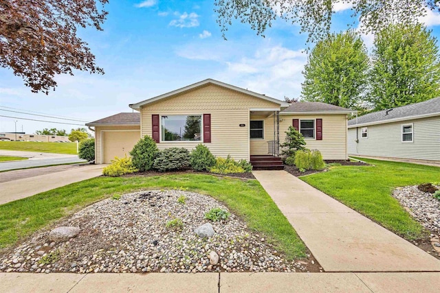 904 S Hamlin St, Shawano, WI 54166 - view of front of home featuring a front lawn, a garage, and concrete driveway