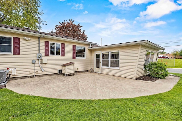 904 S Hamlin St, Shawano, WI 54166 - back of house with a lawn and a patio