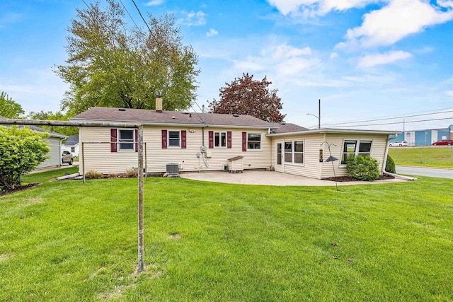 904 S Hamlin St, Shawano, WI 54166 - rear view of house with a patio, a yard, and central AC