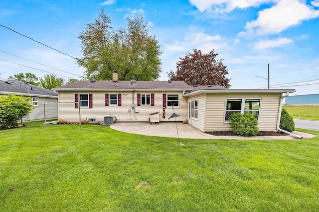 904 S Hamlin St, Shawano, WI 54166 - rear view of property with a patio, central air condition unit, and a chimney