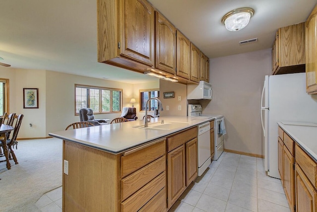 211 Oconomowoc Pkwy, Oconomowoc, WI 53066 - kitchen featuring a sink, white appliances, baseboards, and light countertops