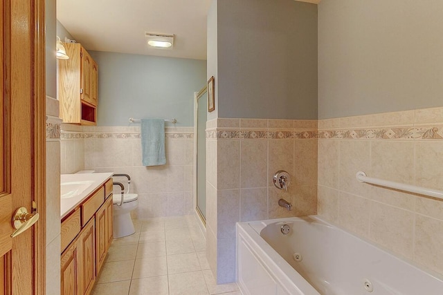 211 Oconomowoc Pkwy, Oconomowoc, WI 53066 - full bathroom with toilet, a whirlpool tub, tile walls, vanity, and tile patterned floors