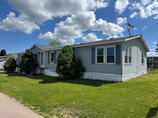 S7559 US Highway 12 Unit M-8, North Freedom, WI 53951 - view of home's exterior with a lawn