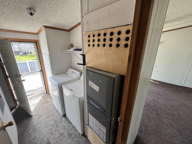 S7559 US Highway 12 Unit M-8, North Freedom, WI 53951 - laundry area featuring carpet, washer and dryer, a textured ceiling, and ornamental molding