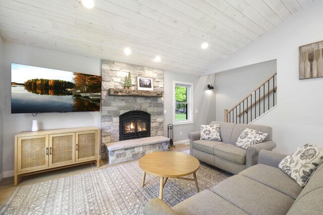 W2434 Timber Trl, Keshena, WI 54135 - living room with wood finished floors, recessed lighting, a fireplace, wood ceiling, and baseboards