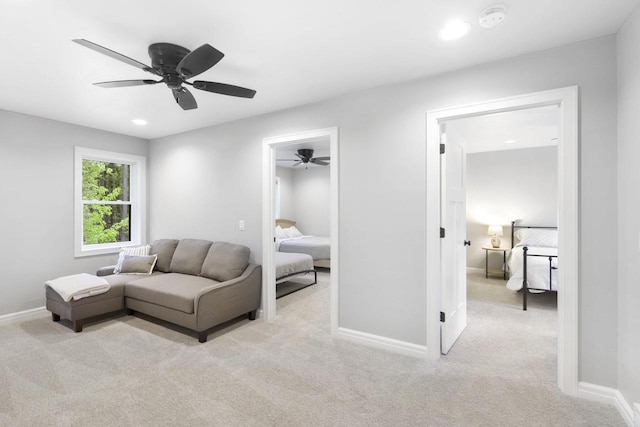 W2434 Timber Trl, Keshena, WI 54135 - living area featuring light colored carpet, a ceiling fan, baseboards, and recessed lighting
