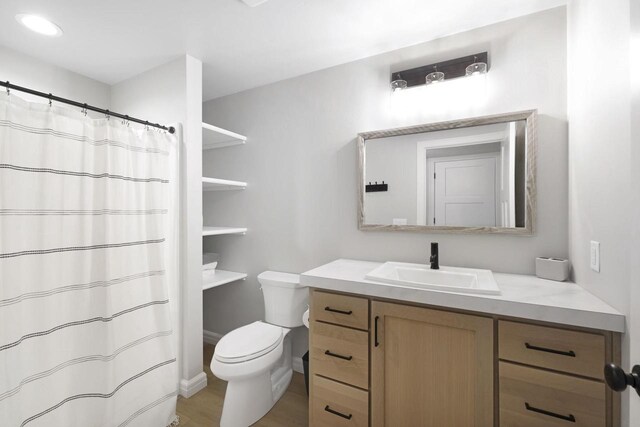 W2434 Timber Trl, Keshena, WI 54135 - full bathroom with vanity, toilet, and a shower with shower curtain