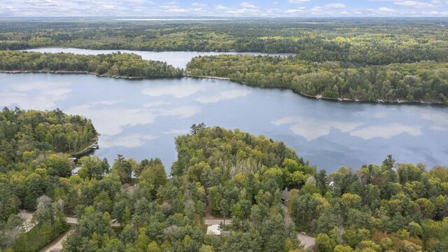 W2434 Timber Trl, Keshena, WI 54135 - view of property location featuring a heavily wooded area and a nearby body of water