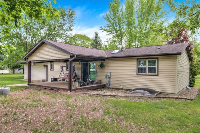 E5777 689th Ave, Menomonie, WI 54751 - rear view of property featuring a patio and a lawn