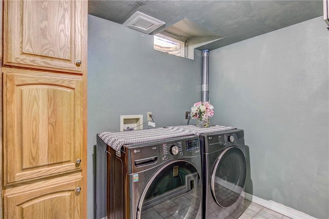 E5777 689th Ave, Menomonie, WI 54751 - washroom with washer and clothes dryer, baseboards, and a textured ceiling