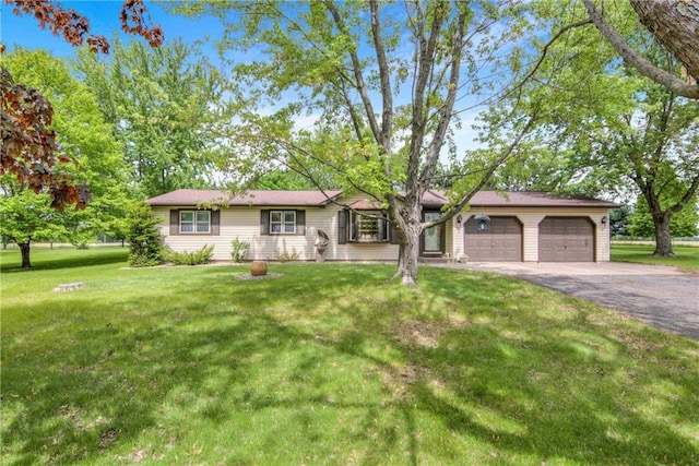 E5777 689th Ave, Menomonie, WI 54751 - ranch-style house featuring asphalt driveway, a garage, and a front yard