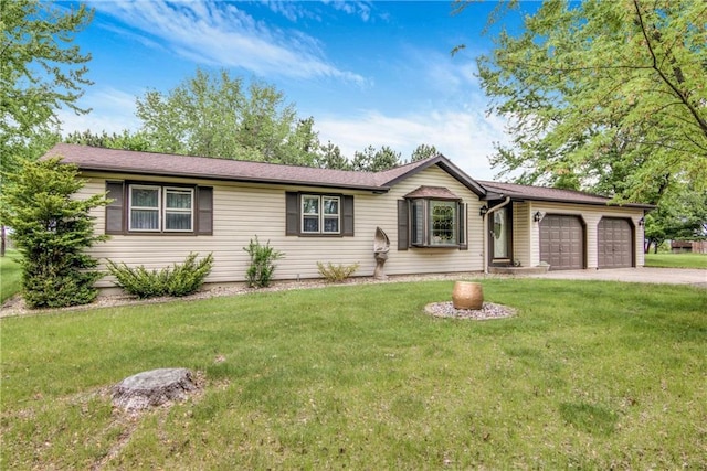 E5777 689th Ave, Menomonie, WI 54751 - ranch-style home with an attached garage, a front yard, and driveway