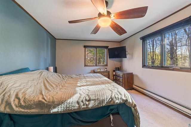 3910 E Koenig Rd, Superior, WI 54880 - bedroom with a baseboard heating unit, carpet, crown molding, and ceiling fan