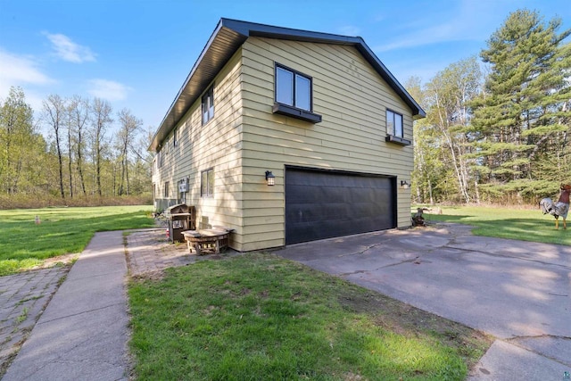 3910 E Koenig Rd, Superior, WI 54880 - view of home's exterior featuring an attached garage, a lawn, and driveway