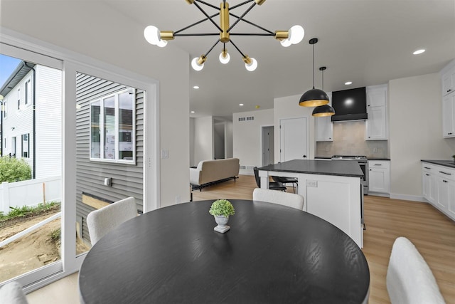 727 Schubert St, Verona, WI 53593 - dining room featuring light wood finished floors, recessed lighting, and a chandelier